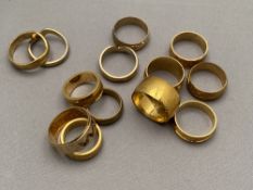 Twelve brass sample wedding rings