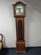 A Tempus Fugit longcase clock with pendulum,