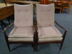 A pair of 20th century stained beech armchairs