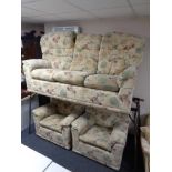 A G-Plan three piece lounge suite upholstered in floral fabric