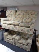 A G-Plan three piece lounge suite upholstered in floral fabric
