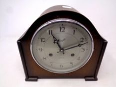 A 1930's oak cased Everite mantel clock with silvered dial