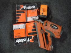 A Paslode impulse Im350 plus nail gun together with two boxes of nails