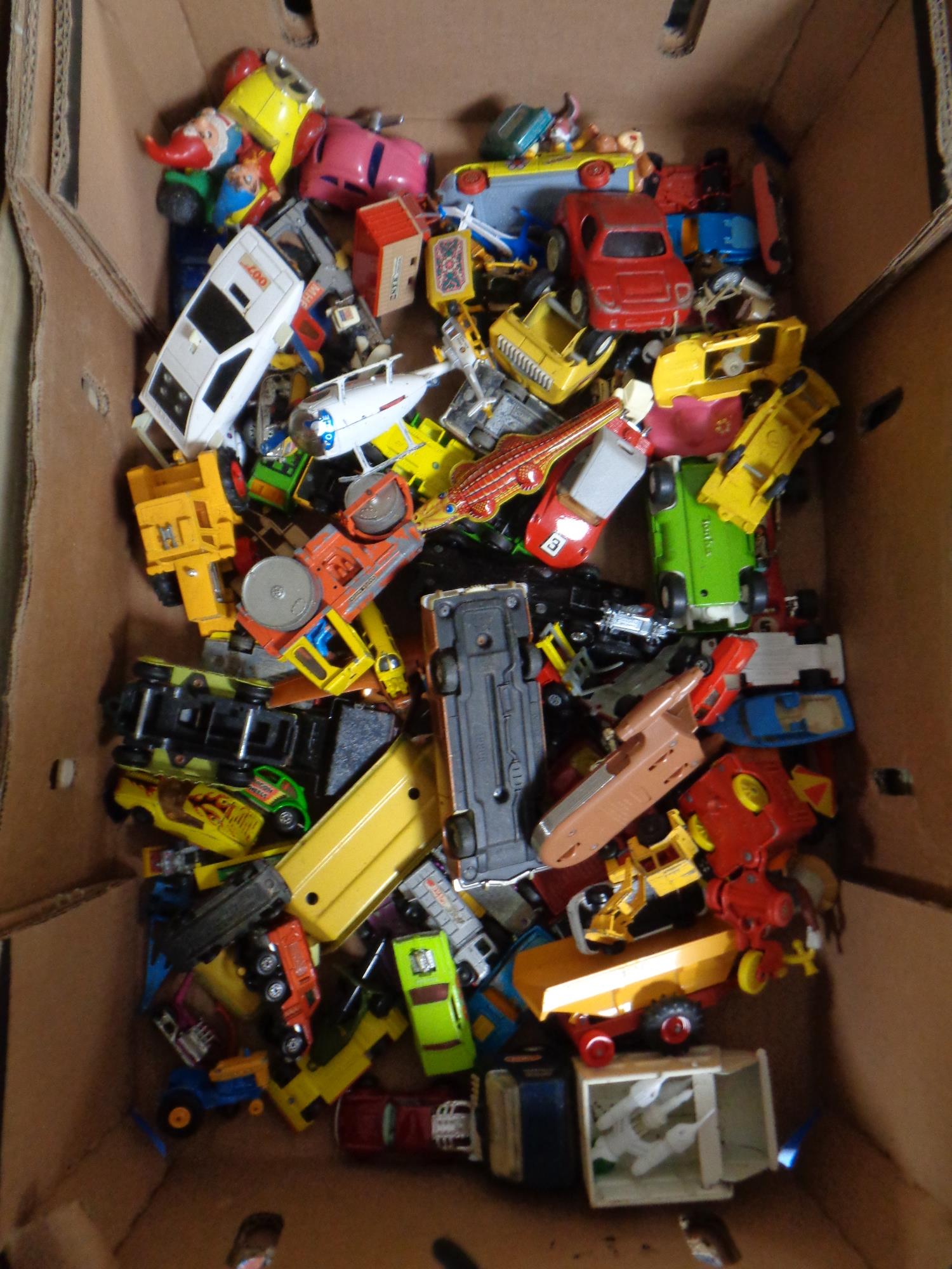 A crate of mid century and later play worn die cast cars, Corgi, Dinky steam roller,