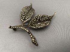 A vintage marcasite leaf brooch
