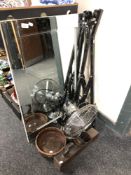 A contemporary frameless bevelled mirror, folding bike rack, desk fan,