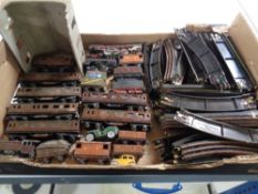 A box of a quantity of Trix twin railway locomotives, coaches,