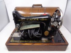 A 20th century Singer electric sewing machine in case