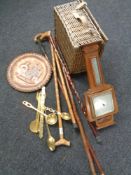 A box of wicker picnic hamper, brass plaque, copper items, walking sticks,