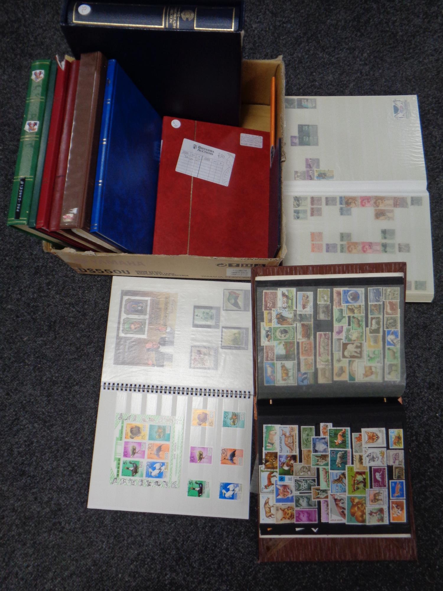 A box of folders albums stamps,