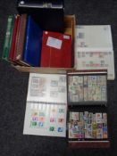 A box of folders albums stamps,