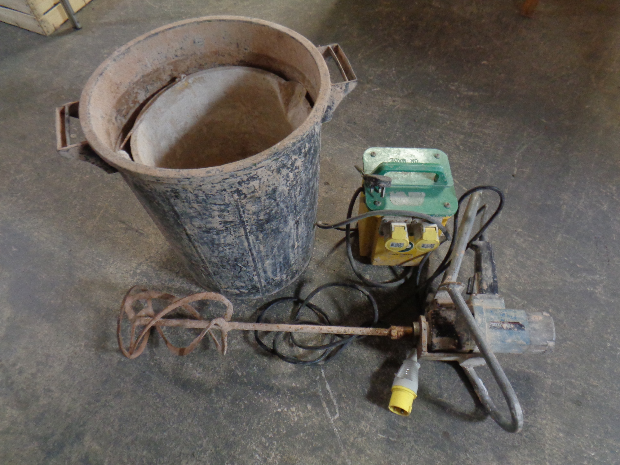 A Makita 110v plastering mixer with bucket and 110v transformer