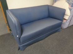 A 20th century Scandinavian two seater settee upholstered in a blue fabric