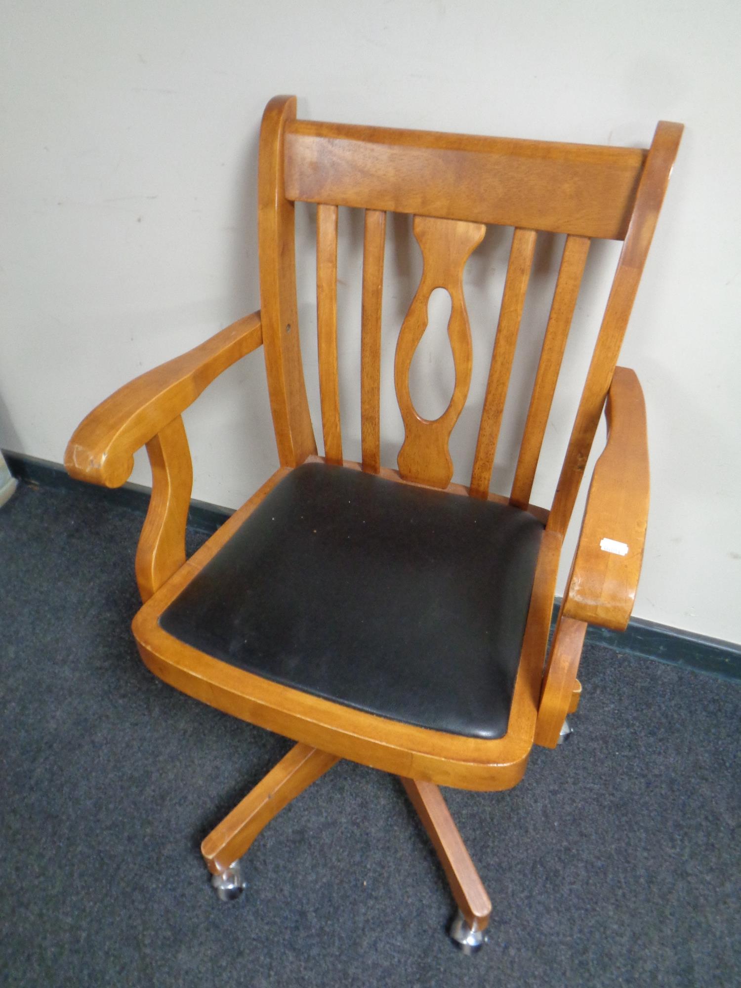 A pine swivel desk chair