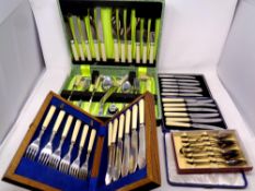 A cased canteen of stainless cutlery together with four further boxes of cutlery, spoons,