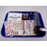 A tray of miscellany to include uncirculated Turkish banknotes, Ingersol pocket watch, crowns,