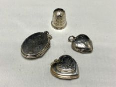 Three silver lockets together with a silver thimble