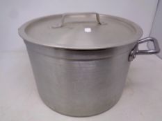 An aluminium lidded cooking pot, diameter 30cm.