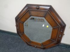 A 1920's octagonal oak framed mirror