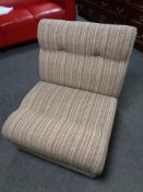 A 20th century folding bed chair upholstered in brown fabric