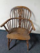 A 19th century elm and beech elbow chair
