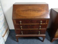 An Edwardian inlaid mahogany writing bureau fitted three drawers beneath