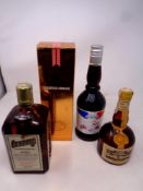 Four bottles of alcohol to include Grand Marnier, Cointreau,