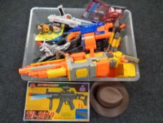 A box of a quantity of assorted toy guns, Action Man figures,