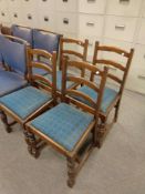 A set of four oak ladder backed chairs