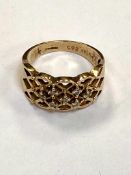 A 14ct yellow gold lattice designed ring set with diamonds, 4.3g.