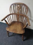 A 19th century elm and beech elbow chair