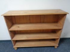 A pine open bookcase