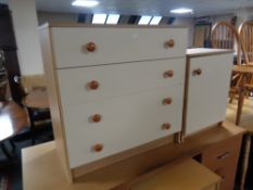 A contemporary chipboard two-tone four drawer chest together with matching bedside cupboard