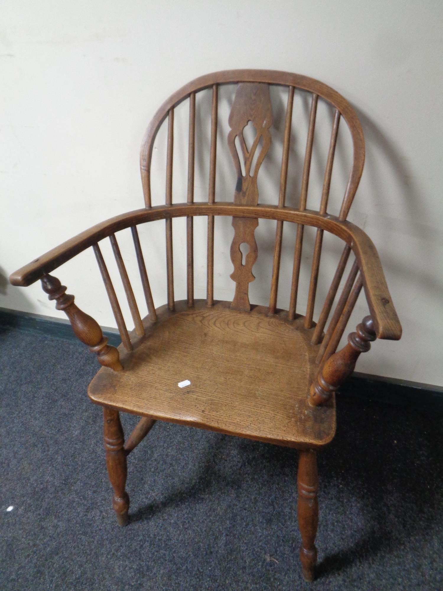 A 19th century elm and beech elbow chair