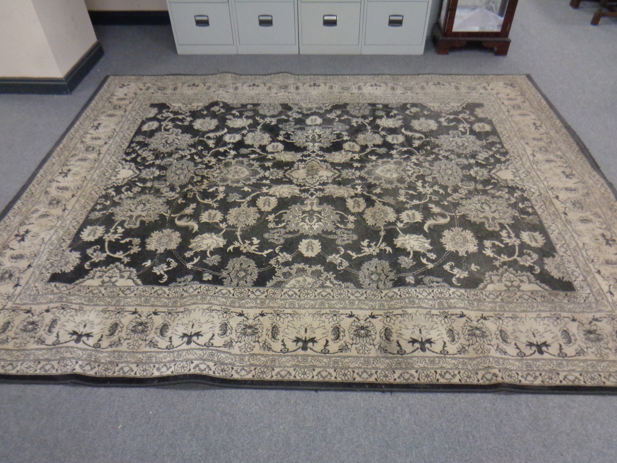 A machine made Persian design carpet on black ground