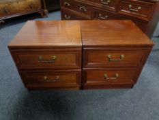 A pair of G Plan two drawer bedside chests in a mahogany finish