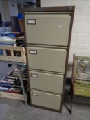 A four drawer metal filing cabinet