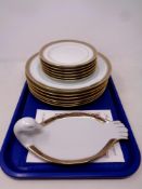 A tray of twelve Limoges dinner and side plates together with a further matching dish in the form