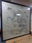 A large silk embroidered panel depicting dragon in frame.