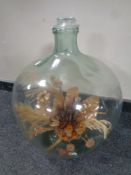 An antique glass carboy