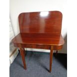 A 19th century inlaid mahogany turnover top D-shaped table