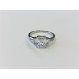 A silver Art Deco style ring set with a clear stone,