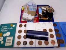 A tray of Great Britain pennies, coin folders, stamps, Benson and Hedges tin, pocket knives,