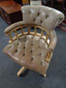 A Chesterfield tan buttoned leather swivel desk chair