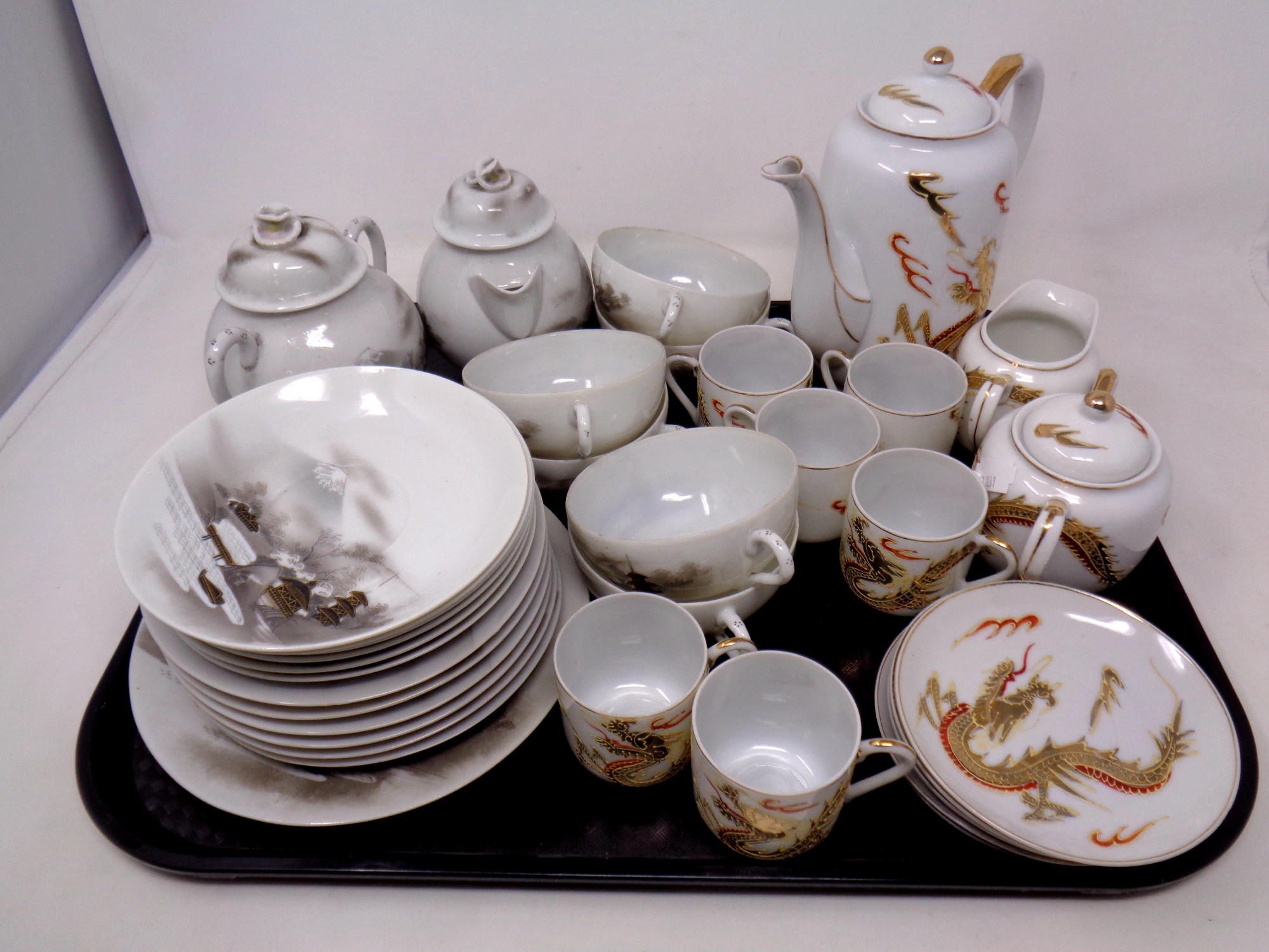 A tray of two Japanese eggshell tea services