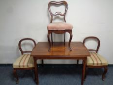 A 20th century mahogany dining table together with a pair of mahogany chairs and a further mahogany