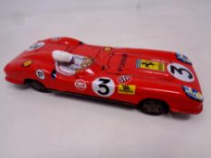 Vintage Sanko Ferrari tin plate model toy car measuring 9 inches in length