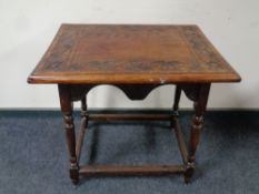 A carved oak occasional table