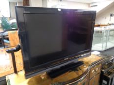 A Sony Bravia 32 inch LCD TV with lead,