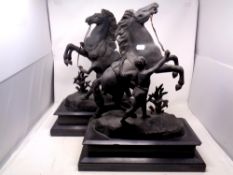 A pair of nineteenth century black spelter figures of rearing horse on black marble plinths